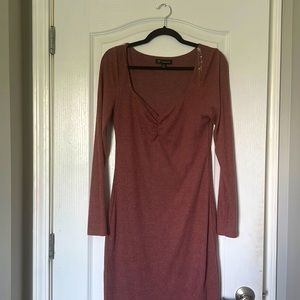 The size is a medium. This dress has a low cut dress. Slit in the front.